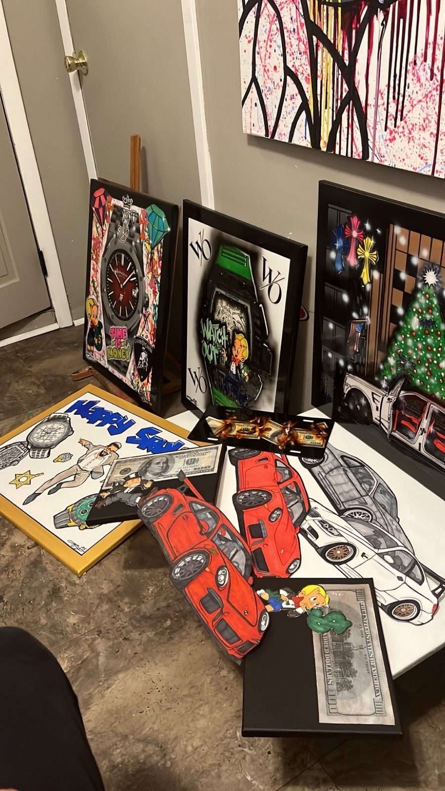 Collection of framed custom paintings and illustrated sports cars