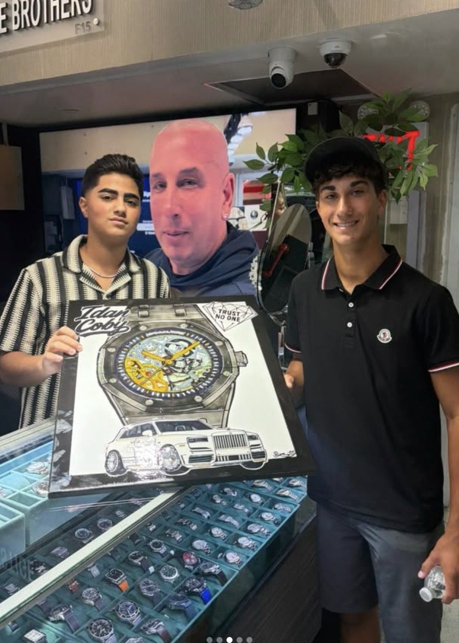 Custom luxury watch and Rolls-Royce painting at a jewelry counter