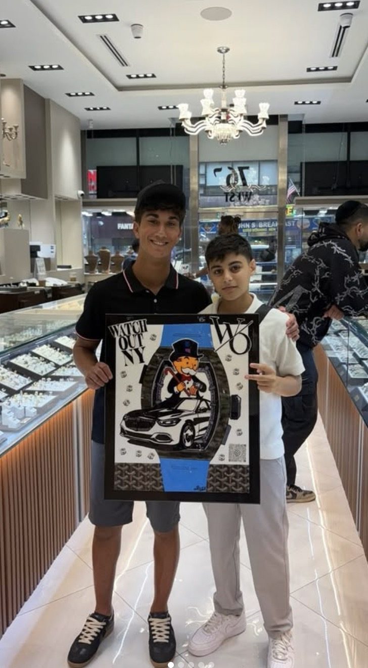 Blue watch and luxury car custom artwork at a jewelry showroom